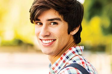Young man with perfectly straight smile