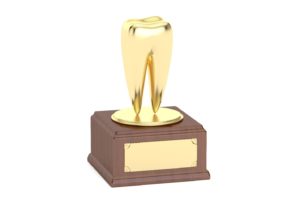 Golden tooth trophy against white background illustrating accomplishments in dentistry