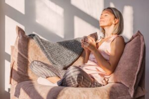 Woman relaxing on her comfy chair at home